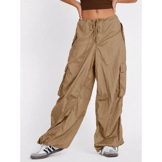 Stylish high-waist safari-inspired cargo trousers for women in black, featuring a comfortable, flattering fit and practical pockets.