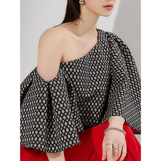 Elegant off-shoulder blouse with butterfly sleeves and vibrant printed pattern