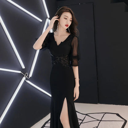 Elegant black evening dress with middle-length sleeves, perfect for formal occasions in the UK