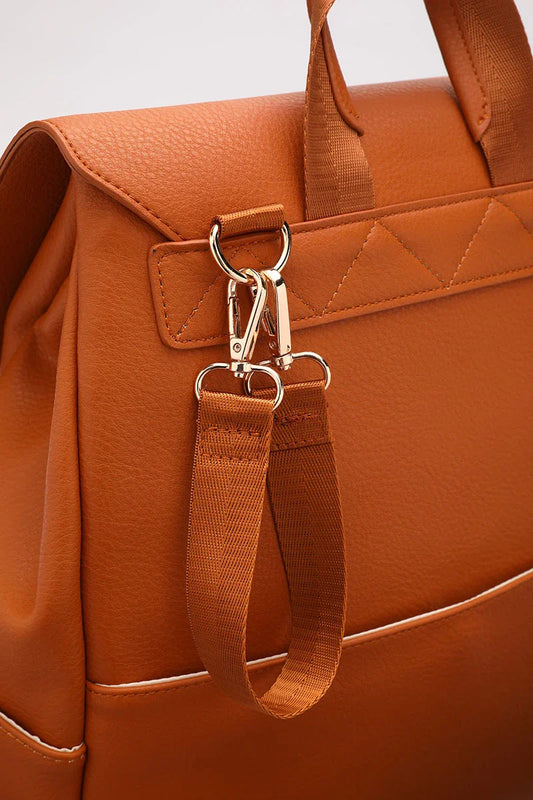 A stylish and practical PU leather mummy bag with a large capacity, multiple pockets, and included accessories like a changing pad and stroller hooks.