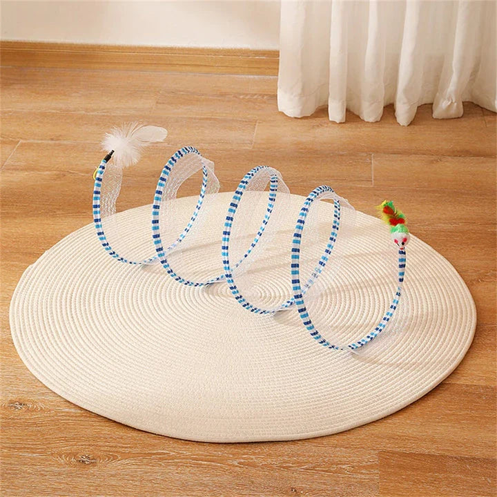 Folding cat play tunnel with various toys like balls, feathers, and mice attached to the sides