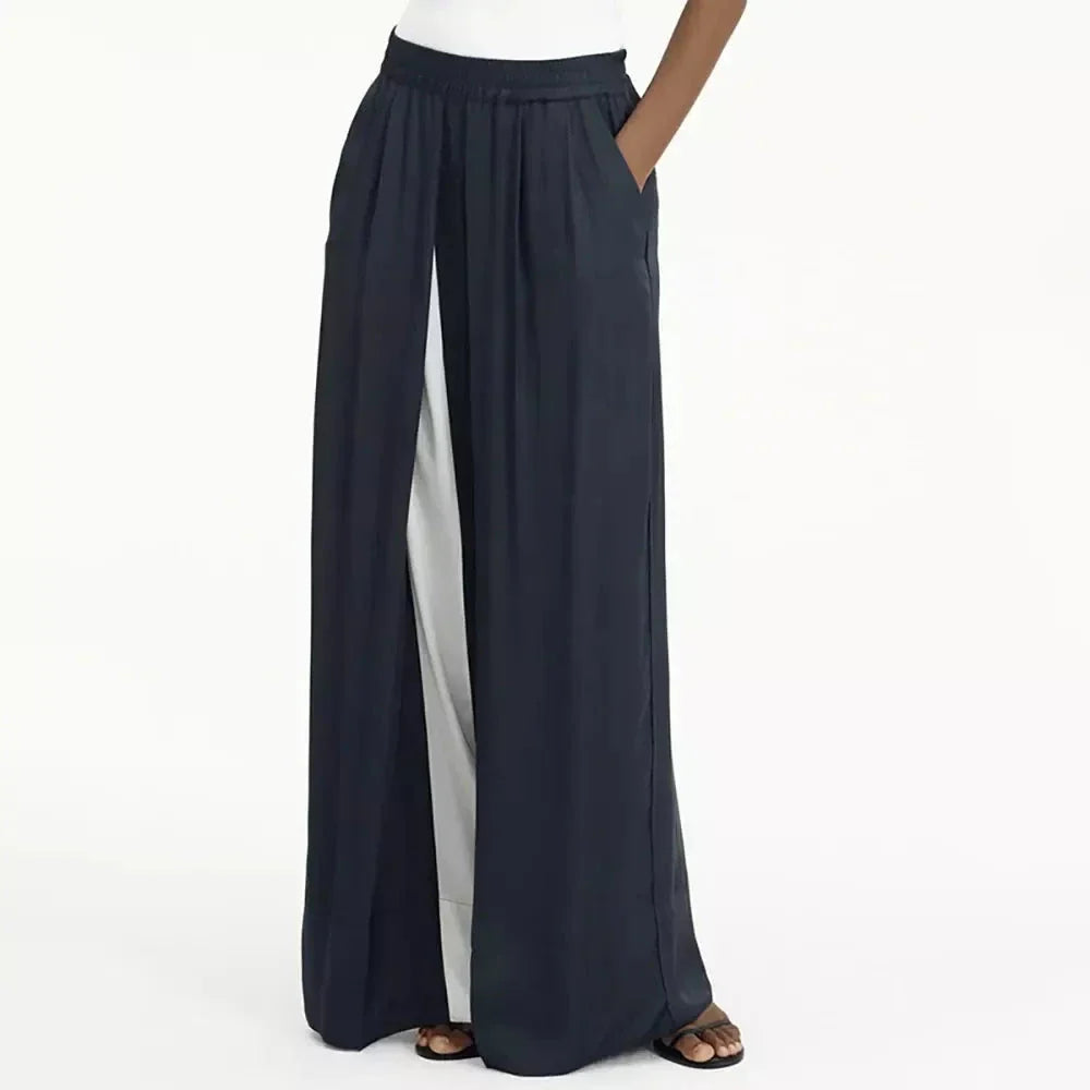 Chic navy high-waist wide-leg trousers with elegant patchwork design, offering timeless sophistication and modern style.
