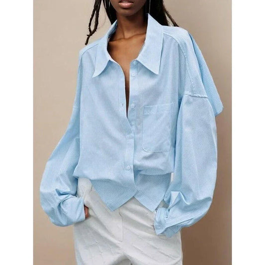 A stylish patchwork blouse with functional pockets, perfect for casual and semi-formal occasions during the autumn and winter seasons.