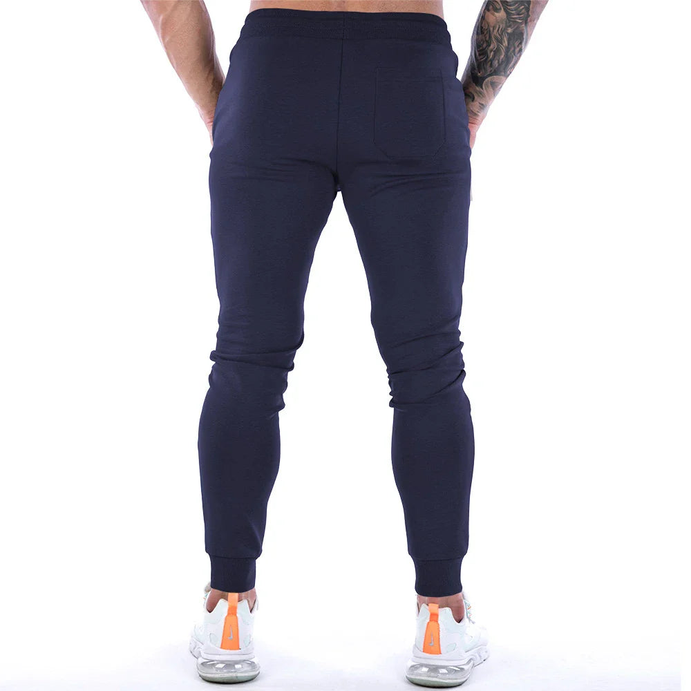 Premium athleisure trousers for stylish British men, featuring a refined sports-inspired design, breathable cotton construction, and a sleek, slim-fit silhouette.