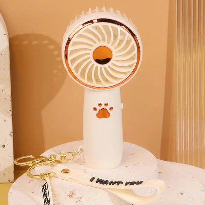 Compact, cartoon-themed USB handheld fan for keeping cool during the summer months