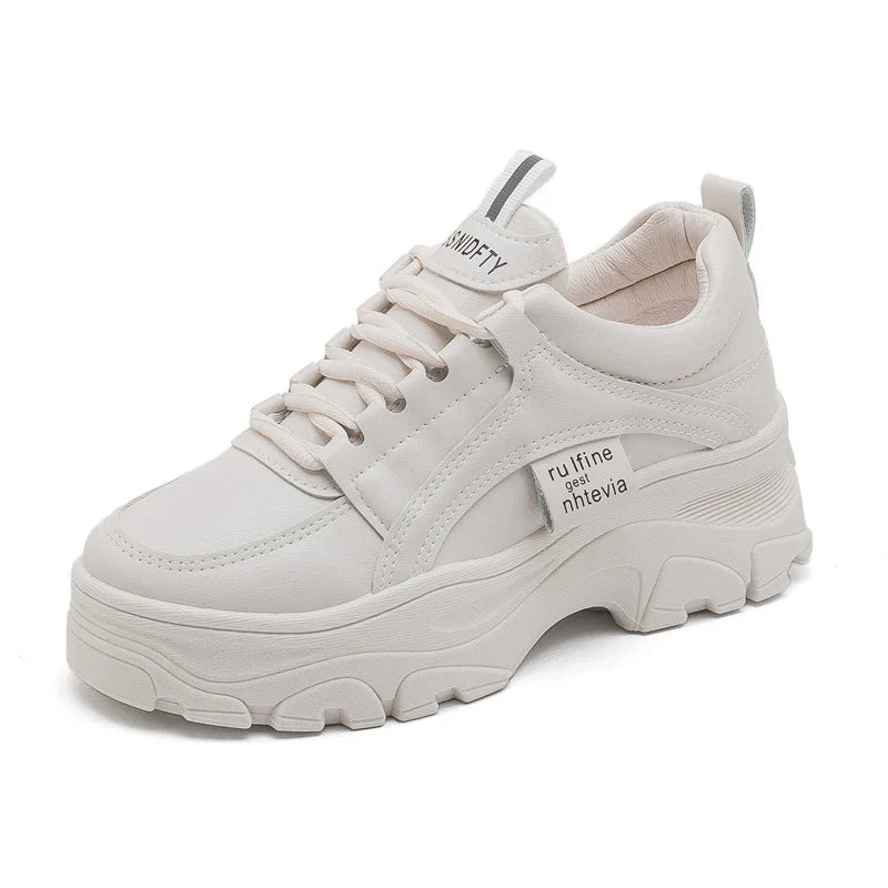 Fashionable women's casual trainers in beige and white colours, featuring a sporty yet chic design for everyday wear.