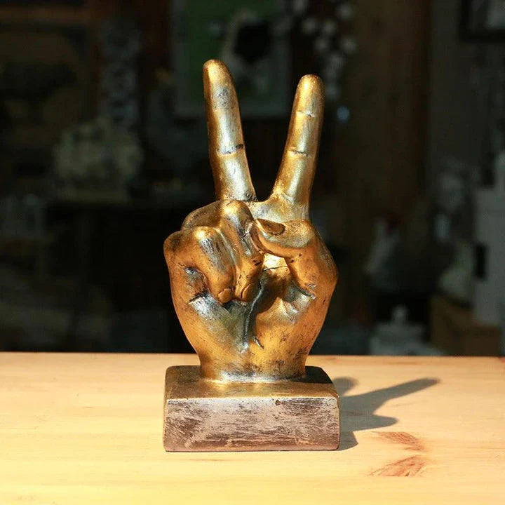 Elegant resin gesture ornaments in a variety of classic bronze and silver finishes, perfect for adding a charming accent to British-inspired home decor
