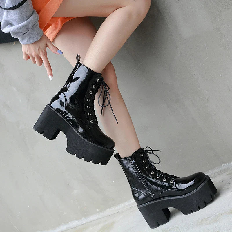 Premium lace-up high heel ankle boots in black, featuring a secure closure, supportive heel, and sleek, sophisticated silhouette.