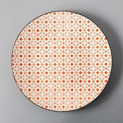 Elegant ceramic plates with vibrant, whimsical prints in a variety of enchanting designs