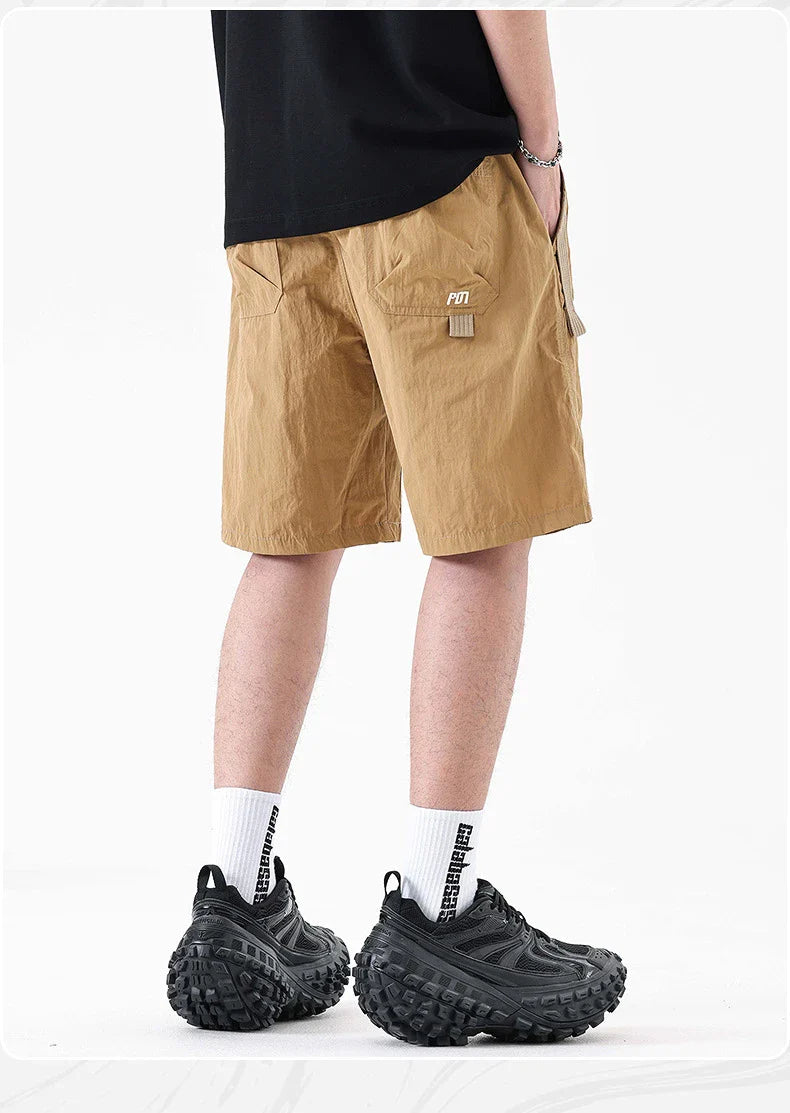 Premium Mountaineering Trousers in black and khaki colours, featuring a relaxed straight-leg fit and durable nylon construction for outdoor adventures.