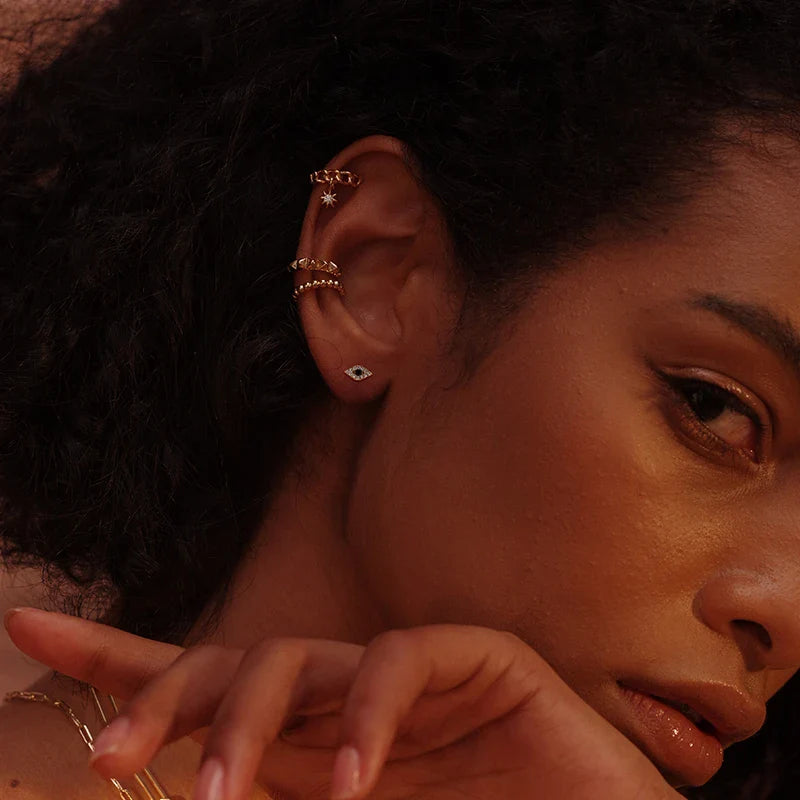 Luxurious gold and dark blue eye earrings with premium 14K gold-plated copper construction for sophisticated style