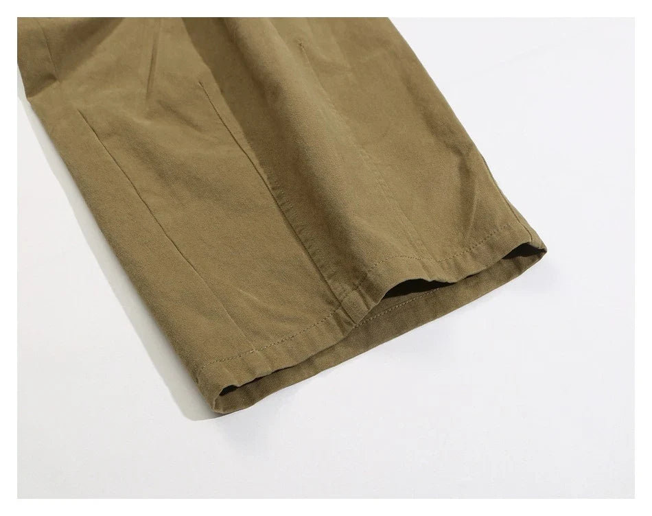 Sophisticated men's casual trousers in various colours, featuring a tailored straight-leg design and mid-rise waistline for a polished, British-inspired look.