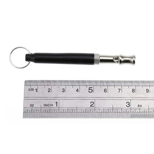 Compact ultrasonic dog training whistle in black and silver color, with a keyring loop for easy attachment