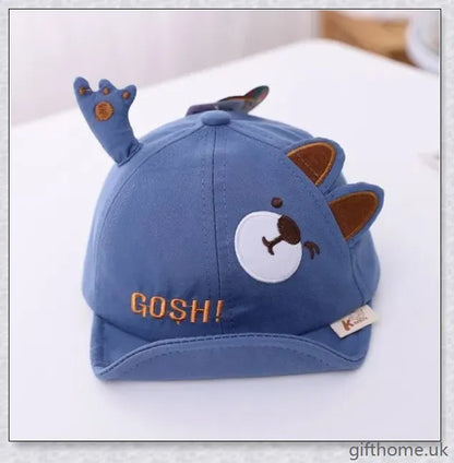 Adorable cartoon baby cap in various colours, made of breathable linen-blend fabric for comfort and sun protection