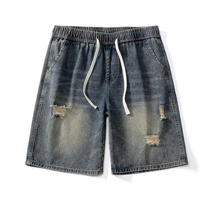 Premium British-crafted vintage-inspired ripped denim shorts for men with a straight-leg silhouette and authentic distressed details