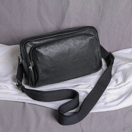 Premium black leather shoulder bag with adjustable strap and multiple compartments for organised storage