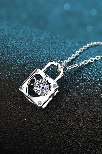 Elegant sterling silver moissanite lock pendant necklace with a minimalist, modern design