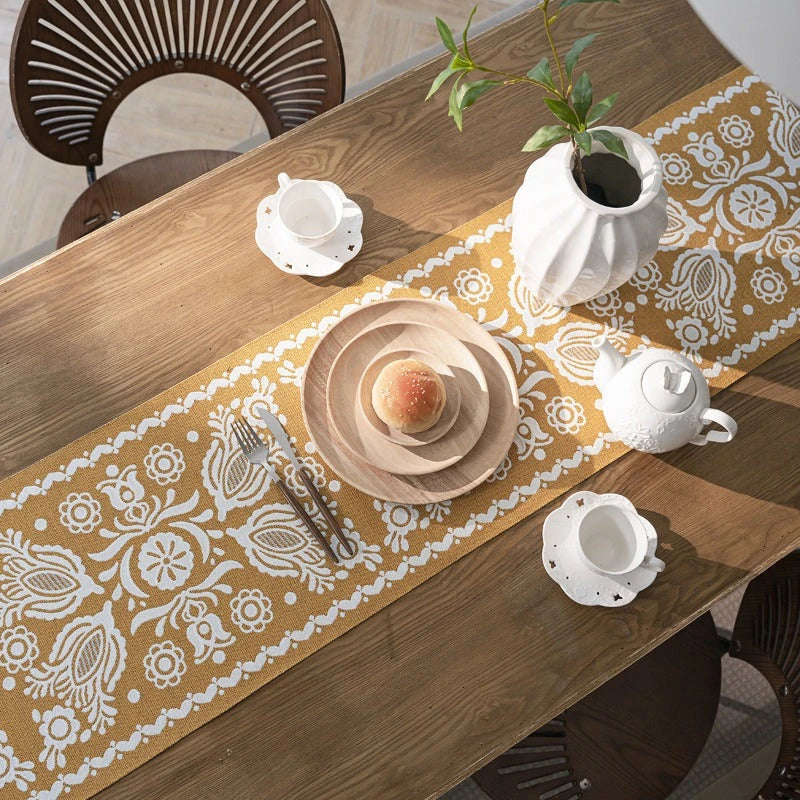 A beautifully crafted jacquard-woven table runner with a geometric pattern in contrasting colours, perfect for elevating your home decor