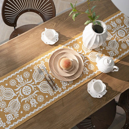 A beautifully crafted jacquard-woven table runner with a geometric pattern in contrasting colours, perfect for elevating your home decor