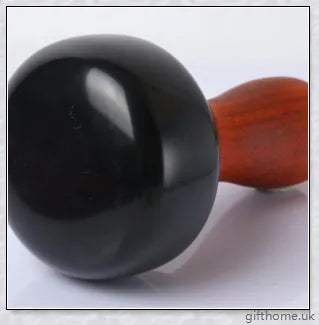 Premium mahogany Bian stone warming moxibustion device with red rosewood accents, designed for traditional Chinese healing practices.