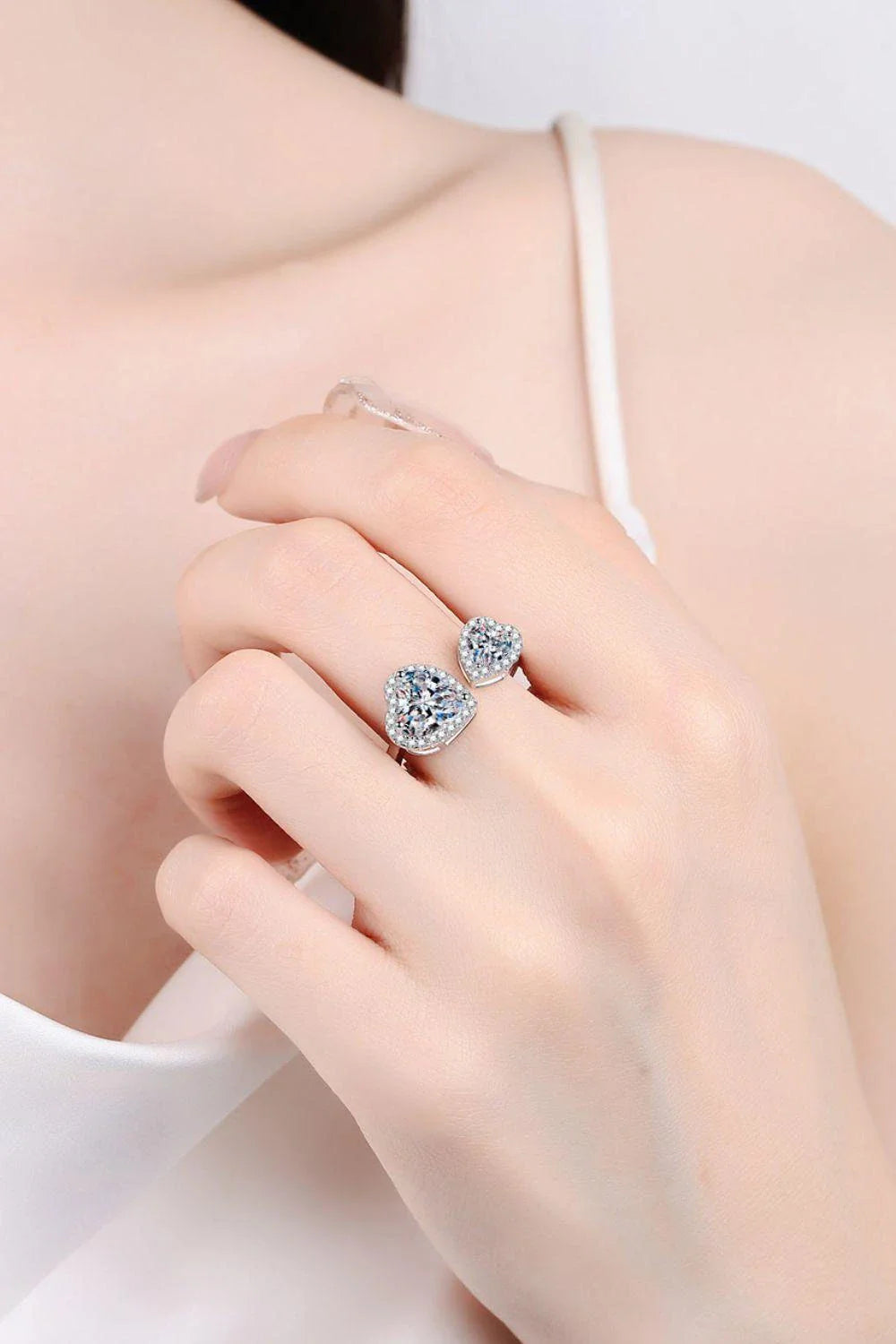 Elegant heart-shaped moissanite open ring in platinum-plated 925 sterling silver with adjustable sizing