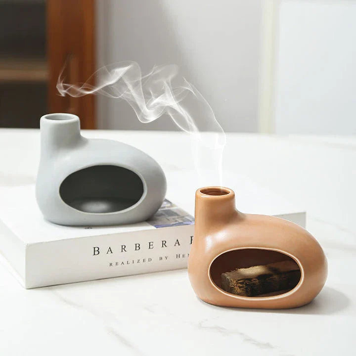 Elegant ceramic tabletop incense burner with Palo Santo wood aroma, available in light brown, white, and grey colours