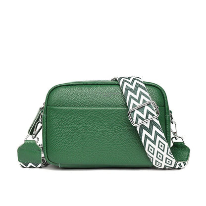 Stylish leather crossbody bag with embroidered strap in various colours