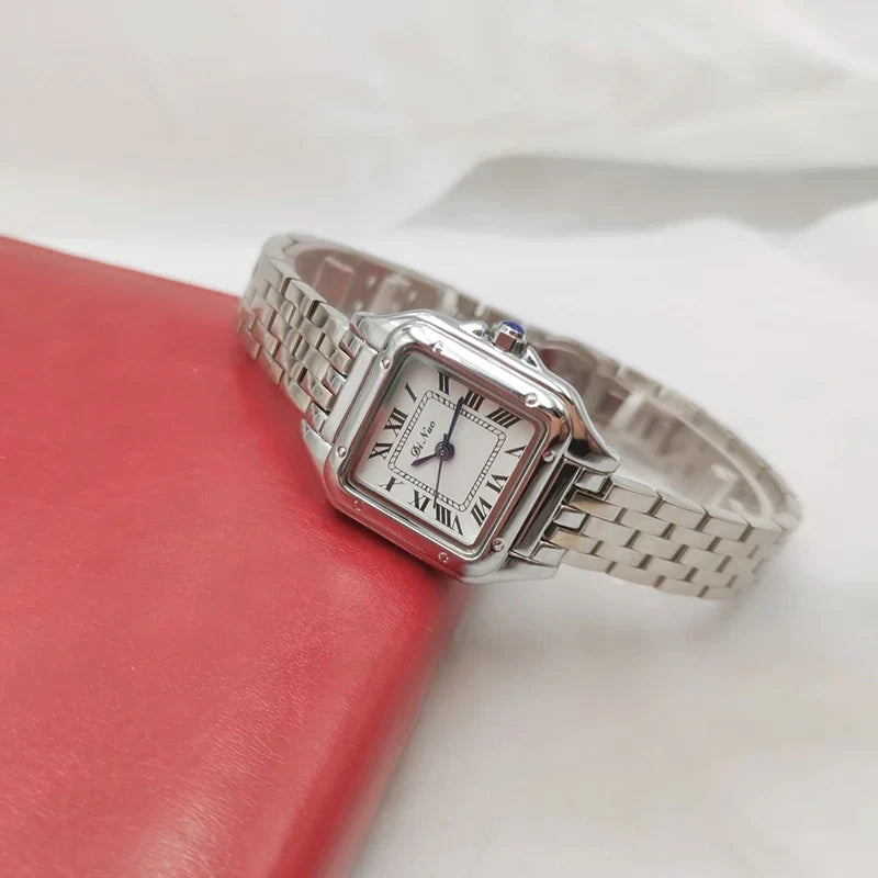 Elegant square quartz watch with a fine steel band, featuring a minimalist design and precise timekeeping.