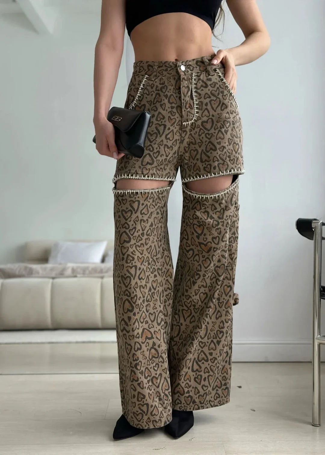Stylish leopard print wide-leg jeans with patchwork design, perfect for fashion-forward women in the UK