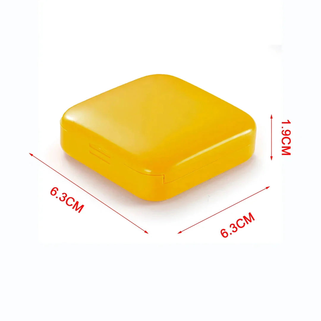 Compact push-pull pill case organiser in various vibrant cartoon-inspired colours for convenient medication management