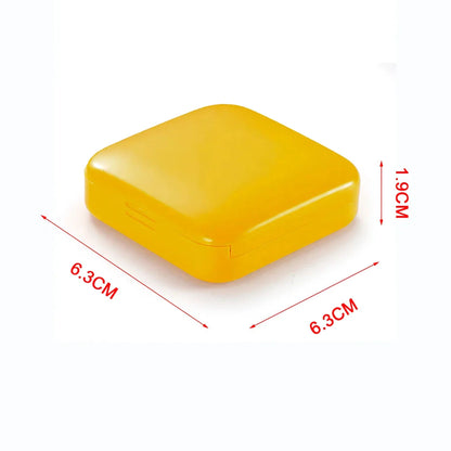 Compact push-pull pill case organiser in various vibrant cartoon-inspired colours for convenient medication management