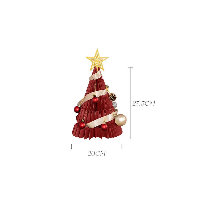A beautifully crafted origami Christmas tree decoration in a Nordic-inspired style, with a warm, glowing illumination
