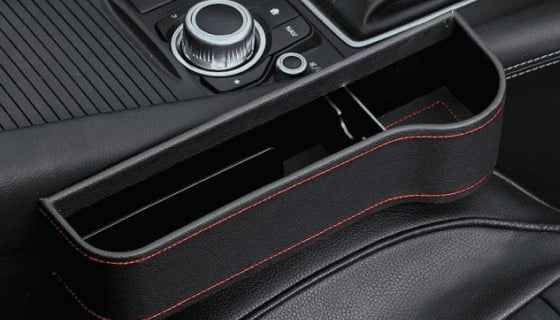 Premium multifunctional car seat organiser with various compartments for storing phones, chargers, pens, and other car essentials