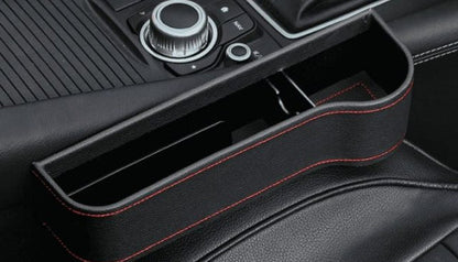 Premium multifunctional car seat organiser with various compartments for storing phones, chargers, pens, and other car essentials