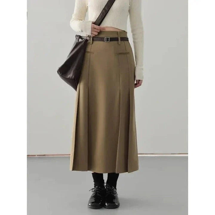 Elegant high-waisted pleated a-line skirt with a flattering silhouette and practical pockets, ideal for autumn and winter in the UK