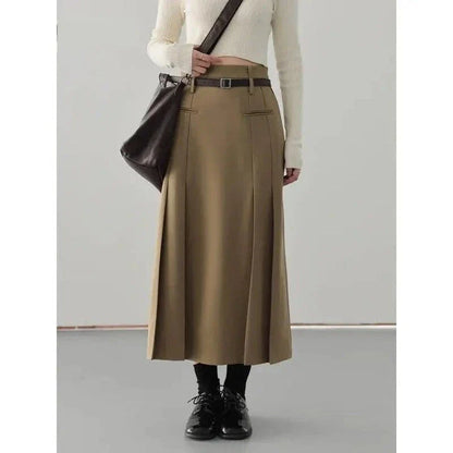 Elegant high-waisted pleated a-line skirt with a flattering silhouette and practical pockets, ideal for autumn and winter in the UK