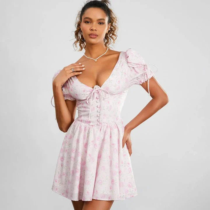 Floral mini dress with puff sleeves, featuring a V-neck, backless design, and A-line silhouette in a vibrant floral print