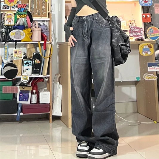 Women's high-waist, wide-leg black denim jeans with multiple pockets and vintage-inspired wash
