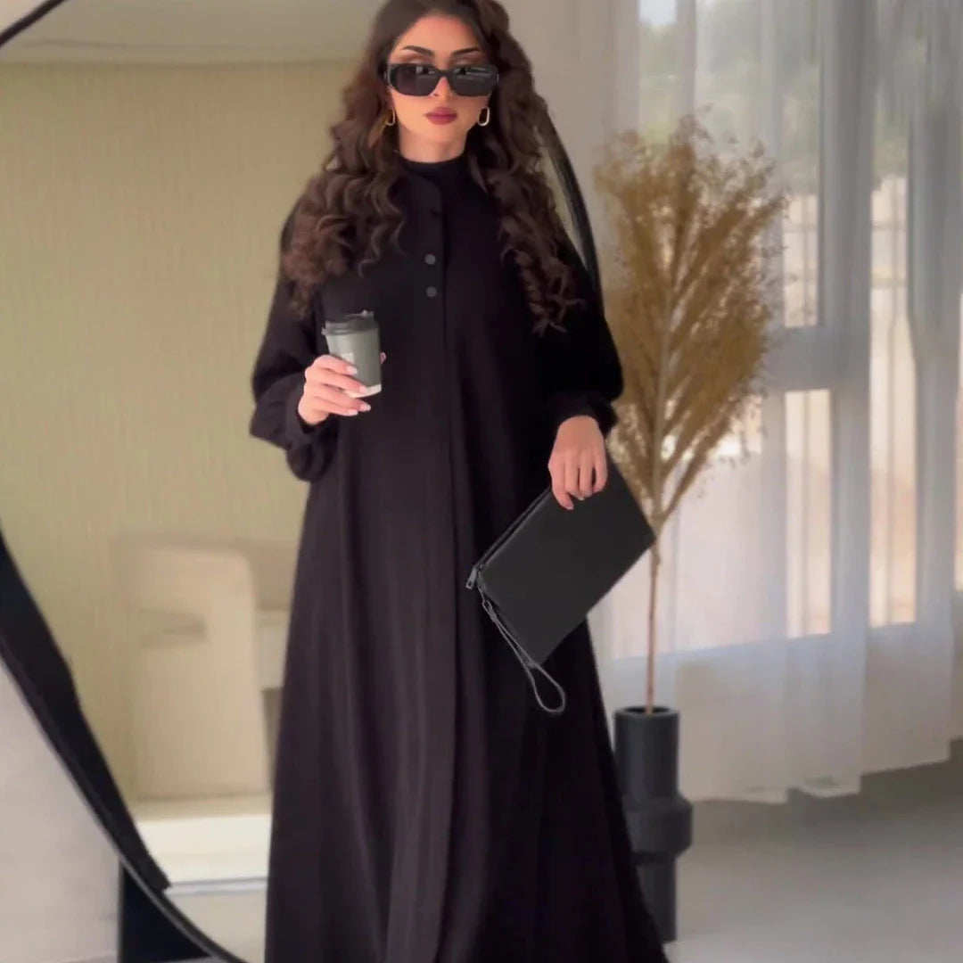 Premium black commuter swing skirt dress with long sleeves and an elegant A-line silhouette