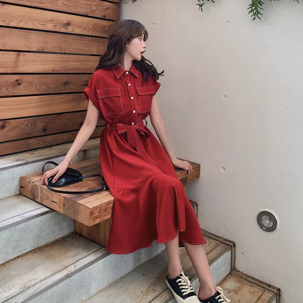 Elegant Hepburn-inspired fishtail shirt dress in blue, featuring a classic shirt design and flattering fishtail silhouette for a timeless British style.