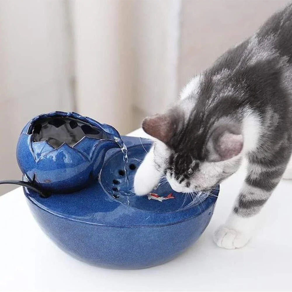 Elegant British-inspired ceramic drinking fountain with adjustable water flow and soothing ambiance