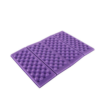 Foldable, waterproof camping mat made of high-quality XPE foam with honeycomb protrusions for added comfort and support