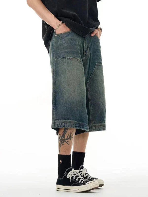 Relaxed-fit men's denim shorts in a vintage blue wash, featuring a wide-leg silhouette and adjustable waistband for maximum comfort.