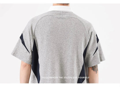 Melange grey polo shirt with contrast stitching, designed and made in Britain for comfortable summer wear