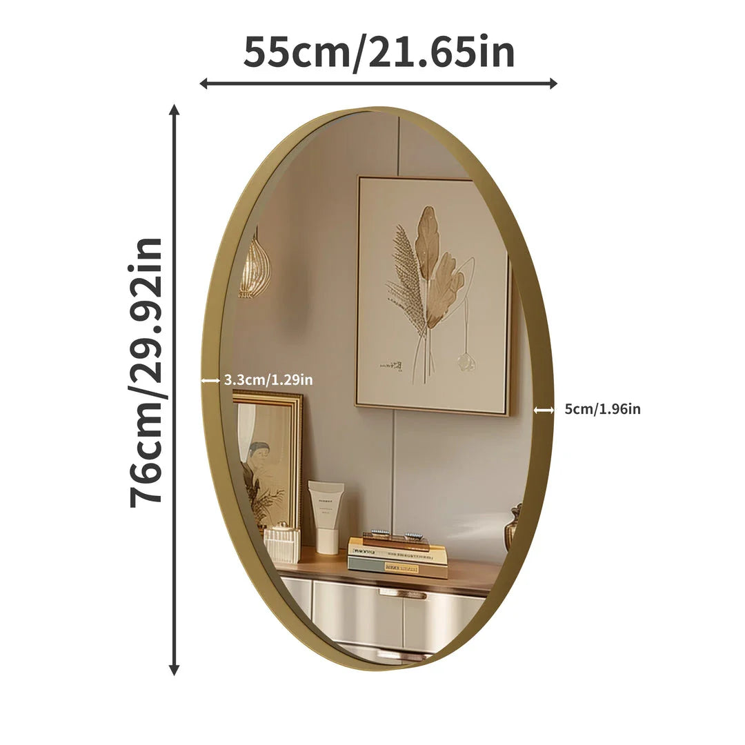 Elegant oval gold wall mirror with brushed gold metal frame, contemporary decorative accent for bedrooms, living rooms, and hallways.