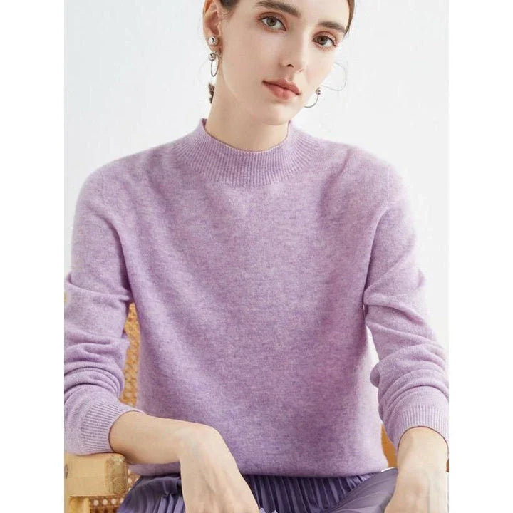 A woman wearing a luxurious Merino wool mock-neck jumper in a stylish autumnal outfit