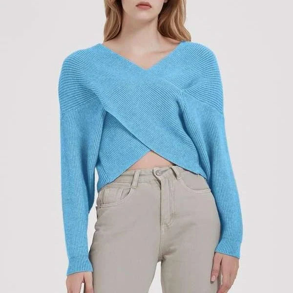 A cosy, brown V-neck knitted jumper with a relaxed, comfortable fit and a touch of vintage-inspired style.