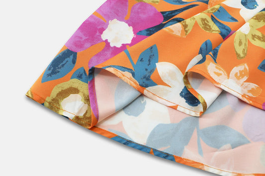 Stylish lantern-sleeve v-neck beach dress in vibrant summer colours, featuring a flattering fit and comfortable stretch fabric