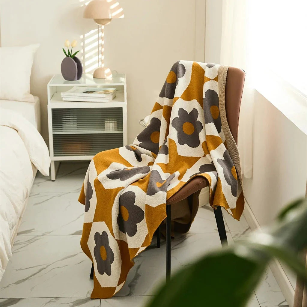 Floral knitted cotton throw blanket in a cosy Matcha Green colour, perfect for British homes and outdoor adventures.