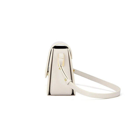 Stylish British-inspired leather shoulder and crossbody bag in black, tan, and navy colours